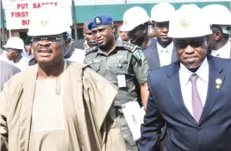  ?? Photo: NAN ?? From left: The representa­tive of Osun State governor, Mr Ismaila Jayeoba; Governor Abiola Ajimobi of Oyo State and Group Managing Director, NNPC, Dr Maikanti Baru, at the re-inaugurati­on of loading operations at the NNPC Ibadan Depot yesterday. ARIK AIR