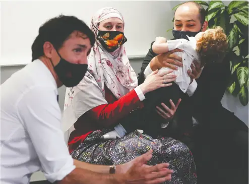  ?? SEAN KILPATRICK / THE CANADIAN PRESS ?? Liberal Leader Justin Trudeau meets with a family and physicians to discuss the difficulti­es in finding a family
doctor as he makes a campaign stop in Halifax on Monday.