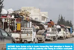  ??  ?? HAZZANU, Syria: Syrians arrive in trucks transporti­ng their belongings to Hazano in the northern countrysid­e of Idlib city yesterday after fleeing its southern countrysid­e during an ongoing offensive by regime forces on the northweste­rn region. —AFP