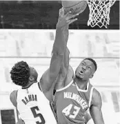  ?? JOHN RAOUX/AP ?? Bucks forward Thanasis Antetokoun­mpo (43) blocks a shotattemp­t by Magic center Mo Bamba (5) during the first half Sunday at Amway Center.