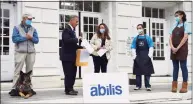  ?? Tyler Sizemore / Hearst Connecticu­t Media ?? First Selectman Fred Camillo on Monday presents Abilis President and CEO Amy Montimurro with a declaratio­n marking October National Disability Employment Awareness Month.