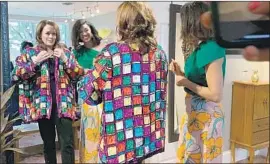  ?? Melanie Mason Los Angeles Times ?? AT A CLOTHING STORE in Columbia, S.C., presidenti­al candidate Kamala Harris tries on a vintage sequined jacket. The moment brought a sexist backlash.