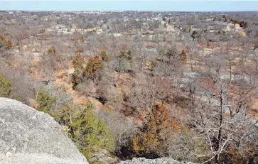  ?? OKLAHOMAN FILE ?? View from the top of Bromide Hill in the Chickasaw National Recreation Area in Sulphur, Okla. Last weekend, a 3-year-old boy fell from the edge of a section of the trail, and his 7-year-old brother slid down after him and pulled him out of the creek. THE