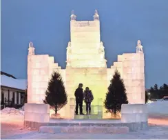  ?? TIM GAFFNEY ?? The Eagle River ice castle is a favorite spot for photograph­s, especially at night when colored lights add to the beauty.