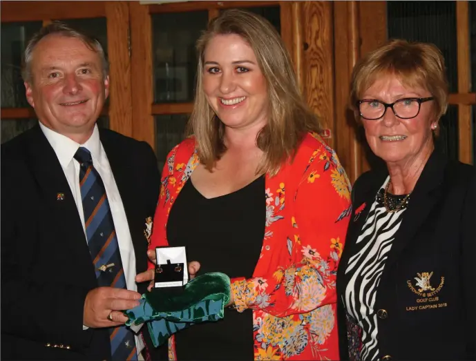  ??  ?? Rhona Cremin is presented with the winner’s prize in the Captain’s Prize to the Ladies at Laytown &amp; Bettystown Golf Club by Club Captain Bryan Collins and Lady Captain Rita O’Connor.