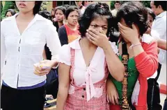  ?? HENG CHIVOAN ?? Cambodian maids arrive in Phnom Penh in February 2012 after returning from alleged abusive workplaces in Malaysia.