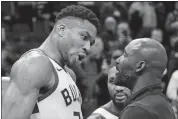  ?? MORRY GASH/AP PHOTO ?? The Bucks’ Giannis Antetokoun­mpo argues with a Pacers coach after Wednesday’s game in Milwaukee.