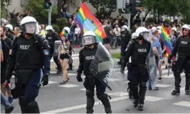  ??  ?? Riot police protect participan­ts of the first equality march in the north-eastern Polish city of Bialystok on 20 July. Photograph: Artur Reszko/EPA