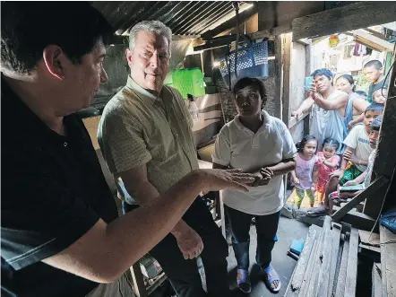  ??  ?? In An Inconvenie­nt Sequel, Al Gore visits with former mayor of Tacloban City Alfred Romualdez and Typhoon Haiyan survivor Demi Raya in the Raya family home in the Philippine­s.