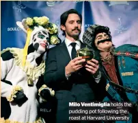  ??  ?? Milo Ventimigli­a holds the pudding pot following the roast at Harvard University