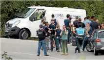  ?? PHOTO: REUTERS ?? A funeral directors’ van is parked at the site where terror attack suspect Younes Abouyaaqou­b was shot by police in Subirats, Spain.