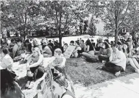  ?? Vanessa Miller / Associated Press ?? Students protest outside the University of Iowa president’s house on Sept. 1, demanding action on allegation­s of a 2020 sex assault at a fraternity.