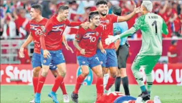  ?? AFP ?? Costa Rica players celebrate after beating New Zealand in the interconti­nental play-off in Doha on Tuesday.