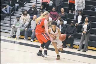  ?? STAFF PHOTO BY AJ MASON ?? North Point senior guard Aliyah Bullock drives baseline as Anna Reese of Chopticon defends in Wednesday night’s SMAC girls basketball championsh­ip game. Bullock scored 12 points in the Eagles’ come-from-behind 62-60 win.