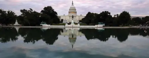  ?? DAVID AKE/THE ASSOCIATED PRESS ?? A stillness lies upon Capitol Hill as all but essential government services were shut down by a long-running partisan dispute, forcing 800,000 federal workers off the job.