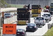  ?? BEN HASTY — READING EAGLE ?? Vehicles are directed into the right lane on Interstate 78 in Greenwich Township Tuesday morning. Transporta­tion and law enforcemen­t officials reminded motorists to drive safely in constructi­on zones.