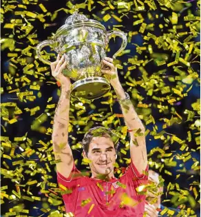  ?? — aP ?? Highest earner: In this Oct 27, 2019, file photo, Switzerlan­d’s Roger Federer holds the trophy aloft after winning his tenth title at the Swiss Indoors tennis tournament in Basel, Switzerlan­d.