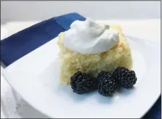  ?? (Arkansas Democrat-Gazette/Kelly Brant) ?? Lemon Buttermilk Cake with whipped cream and fresh blackberri­es