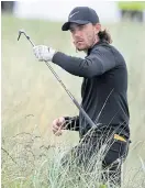  ??  ?? Tommy Fleetwood prepares to play from the rough on the sixth hole.