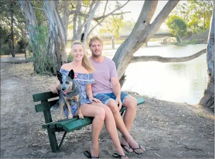  ??  ?? REASON TO SMILE: Kirsty O’connell and Liam Niewand, pictured with their dog Luna, will celebrate Valentine’s Day as an engaged couple. Picture: BARRY KING