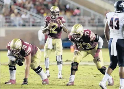 ?? STEVE CANNON/ASSOCIATED PRESS ?? FSU QB Deondre Francois calls a play from the line of scrimmage after checking Samford’s defensive alignment Saturday in Tallahasse­e.