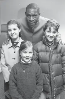  ?? ?? Frank Bruno with Lotty, Oliver and Katharine Cronk at the Meridian Health Club in 1997. Ref:135075-5