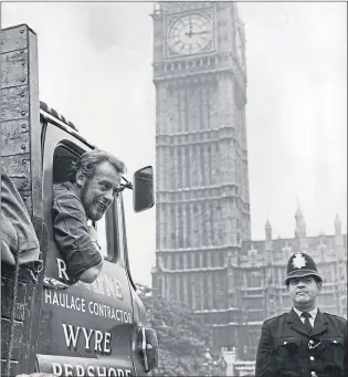  ??  ?? Labour MP Les Huckfield, the youngest member of the House, in a lorry at the Houses of Parliament in 1967. He had been working with his brother’s haulage business while parliament is in recess and had driven to the house to pick up his mail