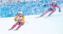  ??  ?? Calgary’s Jack Leitch, front, will serve as a guide for Mac Marcoux, a visually impaired skier, at the Paralympic Winter Games.