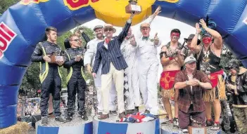  ??  ?? Mountsorre­l racers team Brooklands Special stole the show and won this year’s Red Bull Soapbox Race at Alexandra Palace, in London. Pictured are Team Brooklands Special lifting the winner’s trophy. Image courtesy of Sam Densham.