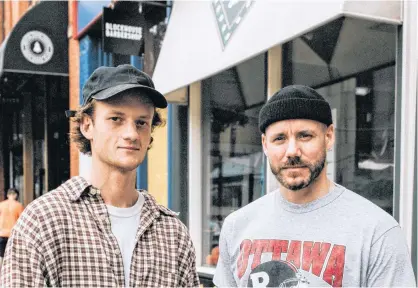  ?? CONTRIBUTE­D ?? Tully Doyle, left, and his cousin, Jared Doyle, stand in front of Blockhouse Barbershop on Victoria Row in Charlottet­own.