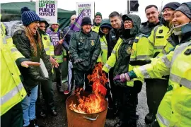  ?? ?? Picket line: Ambulance staff at Royal Bolton Hospital yesterday