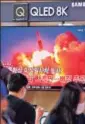  ?? AFP ?? News showing file footage of a North Korean missile test, at a railway station in Seoul.