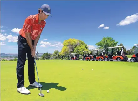  ?? ADOLPHE PIERRE-LOUIS/JOURNAL ?? The University of New Mexico’s lone senior starting men’s golfer, Andrej Bevins, gets in some practice time putting preceding the NCAA Championsh­ips, which will commence Friday in Sugar Grove, Ill.