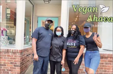  ??  ?? Carl “Ed” Plummer, Proeyah Benton, Tisha Hudson and Ahniyh Napper outside 129 Court St., where they share a business space.