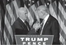  ?? John Locher, Associated Press file ?? President-elect Donald Trump shakes hands with Vice President-elect Mike Pence as he gives his acceptance speech during the early-morning hours of Nov. 9, 2016, in New York.