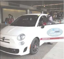  ??  ?? Auto Show visitors interested in a Fiat Abarth take a test drive.