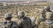  ?? MAURICIO LIMA / NEW YORK TIMES ?? U.S. soldiers command a post outside Manbij, Syria, last week. There are reports of dozens of Russian nationals killed in fighting between pro-government forces in Syria and the U.S.-led coalition.