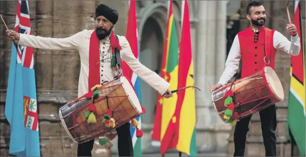  ?? PICTURES: PA WIRE. ?? BANGING THE DRUM: The Dhol Foundation drummers during a pre-recording of the BBC’s A Celebratio­n for Commonweal­th Day at Westminste­r Abbey in London.