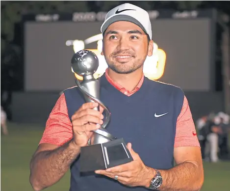  ?? Picture: Getty. ?? Former world No 1 Jason Day with the Japan Skins Challenge trophy after his success in Chiba.