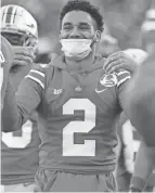  ?? JOSHUA A. BICKEL/COLUMBUS DISPATCH ?? Ohio State receiver Chris Olave, who did not play in the Rose Bowl, celebrates a Buckeyes touchdown against Utah.