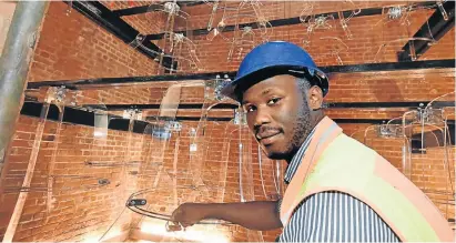  ?? Picture: EUGENE COETZEE ?? TOWER PHANTOMS: The site manager at the Campanile, Siya Maninjwa, shows the new ‘ghost bells’