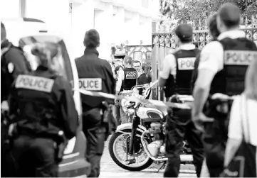  ??  ?? Police secure the scene where French soliders were hit and injured by a vehicle in the western Paris suburb of Levallois-Perret, France. — Reuters photo