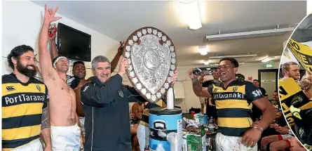  ??  ?? Coach Colin Cooper lifts the shield after his team’s 55-43 victory over Canterbury.