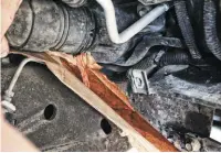  ??  ?? Due to the Duramax radiator not incorporat­ing a drain plug, draining the engine’s coolant can be a messy job. Using a piece of cardboard, wedged between the frame and radiator hose, Bosie was able to minimize the mess by deflecting coolant into a 5-gallon bucket.