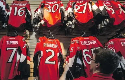  ?? ERROL McGIHON ?? Fans visiting the Sens Store at Canadian Tire Centre were greeted by a startling sight on Tuesday: a No. 2 jersey bearing the name of Dion Phaneuf, who was acquired from the Toronto Maple Leafs as part of a surprising nine-player deal.