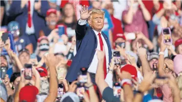  ?? NELL REDMOND THE ASSOCIATED PRESS ?? Why does U.S. President Donald Trump gather his devout followers in crowds and expose them to potential death, asks Rick Salutin. It’s as though the true sign of their devotion is that they must be willing to be killed by him.