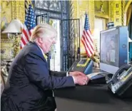  ?? THE ASSOCIATED PRESS ?? President Donald Trump speaks with members of the armed forces via video conference at his private club, Mara-Lago, on Thanksgivi­ng in Palm Beach, Fla.