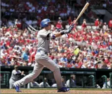  ??  ?? Los Angeles Dodgers' Cody Bellinger watches his solo home run during the fourth inning of a baseball game against the St. Louis Cardinals on Monday in St. Louis. AP PHOTO