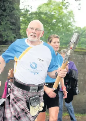  ??  ?? Honour Councillor Bob Ellis was chosen as one of the baton-bearers when Blairgowri­e welcomed the Queen’s Baton Relay in July 2014 as part of the celebratio­ns building up to the Commonweal­th Games in Glasgow that year