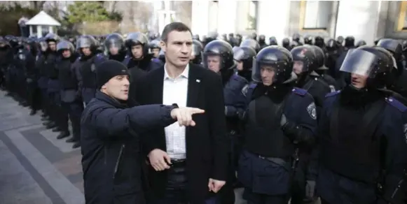  ?? STOYAN NENOV/REUTERS ?? "Russia wants to impose its will on us," says Vitali Klitschko, centre, leader of the Ukrainian Democratic Alliance for Reform.